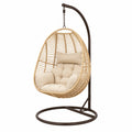 Fauteuil suspendu œuf extérieur 1 place en rotin synthétique PE beige support acier marron foncé coussins écru 105 x 105 x 196 cm